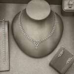 Marquise crystal bridal necklace set with matching bracelet and drop earrings in silver-tone.