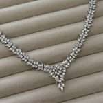 V-drop bridal necklace with marquise leaf cubic zirconia crystals in silver-tone, featuring a clustered center pendant.