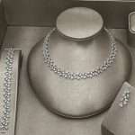 Pear & marquise CZ bridal necklace set with matching bracelet and earrings, silver-tone leaf cluster