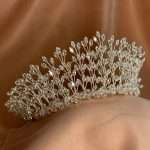 “Side view of a silver bridal tiara with marquise-cut CZ crystals in a leaf-branch design.”