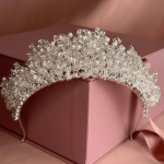 Pearl and clear crystal bridal tiara headpiece displayed on a pink Elnoria gift box