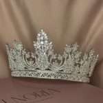 Silver leaf bridal tiara crown with Swarovski and CZ crystals in marquise, pear, and round shapes, photographed on an Elnoria box.