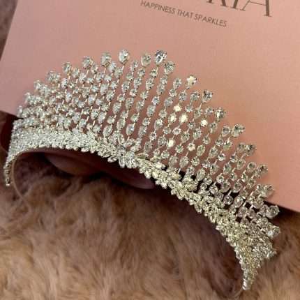 Side view of Swarovski and CZ bridal tiara crown with pear, marquise and round crystals in a tall sparkling design.