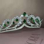 Swarovski and CZ wedding tiara for bride featuring emerald green pear crystals and clear pear and round stones in a silver setting.
