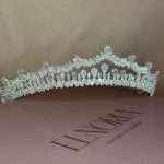 Swarovski bridal tiara crown with pear, marquise, and round crystals displayed on Elnoria box