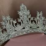 Close-up of a silver wedding crown tiara with Swarovski and CZ crystals in marquise, pear, and round shapes, featuring a leaf-inspired design.