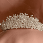 Swarovski clear crystal and pearl wedding tiara crown in a centered close-up showing clustered beadwork