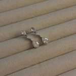Rhodium-plated CZ pear-drop bridal earrings close-up.