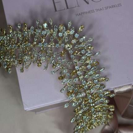 Angled view of the Bronze Bloom Tiara featuring clear and bronze Swarovski crystals in a gold-tone setting.