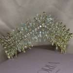 Wide front view of the Bronze Bloom Tiara with clear and bronze Swarovski crystals on a gold-tone base.