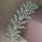 Close-up of crystal leaf garland headband with cubic zirconia stones in silver tone