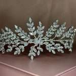 Sparkly botanical bridal headpiece featuring marquise and round cubic zirconia stones in leaf clusters.