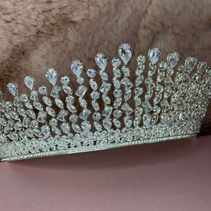 Side view of Crystal Rainfall Crown bridal tiara featuring cascading pear, marquise, round and radiant-cut CZ stones.