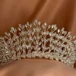 “Close-up of a silver bridal tiara with marquise-cut CZ crystals in a leaf-branch design.”