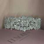 Wide silver pearl bridal headband with clear crystals and cubic zirconia displayed on an Elnoria box.