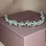 Pearl Crystal Blossom Headband with pearls and clear crystals, full view on blush pink jewelry box