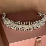 Front view of pearl and clear crystal bridal headband on silver vine wedding hair accessory