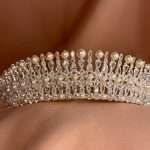 Front close-up of the Moonlit Pearl Tiara with pearls and cubic zirconia stones in pear, marquise, and round shapes.