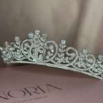 Side view of the Princess Luster Pearl Bridal Tiara featuring Swarovski crystals, CZ sparkle, pearl accents, and silver scrollwork.