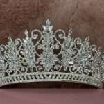 Close-up of the Crystal Snowflake Tiara showing Swarovski crystals and cubic zirconia in marquise and round cuts with snowflake clusters and filigree scroll details.