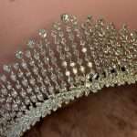 Close-up of Swarovski and CZ bridal tiara with pear, marquise and round crystals in a tall sparkling crown design.