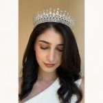 Model wearing the Teardrop Royale Tiara bridal crown with Swarovski and CZ crystals in a full-crown design.