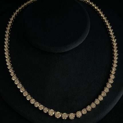 Rhodium-plated cubic zirconia tennis necklace with round-cut stones, photographed on black velvet.