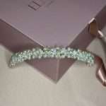 Wedding pearl and clear crystal hair band displayed on blush pink gift box