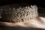 Close view of a clear crystal blossom bridal headband catching evening light