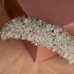 Close-up of the silver crystal bridal headband showing round and marquise cubic zirconia clusters